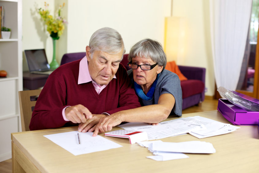 Senior couple in trouble calculating bills and taxes