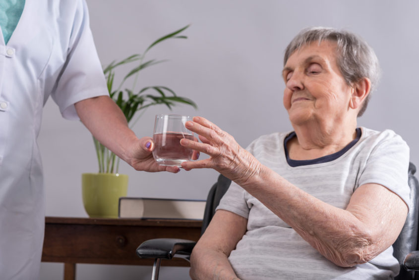 Nurse taking care of an elderly person