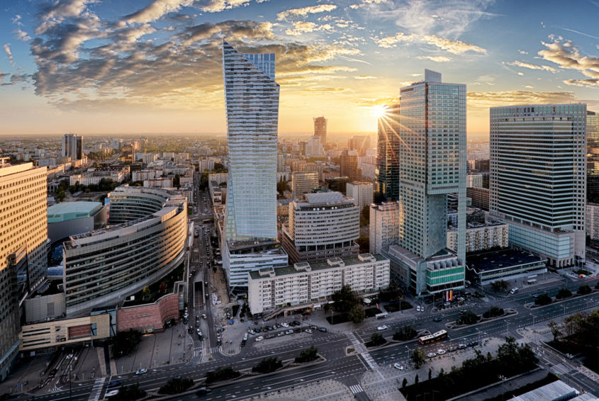 Warsaw city with modern skyscraper at sunset, Poland