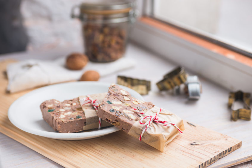 Festive chocolate block tied with string. Shallow depth of field.